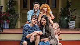 Four characters from Roommates posed together on a front porch.